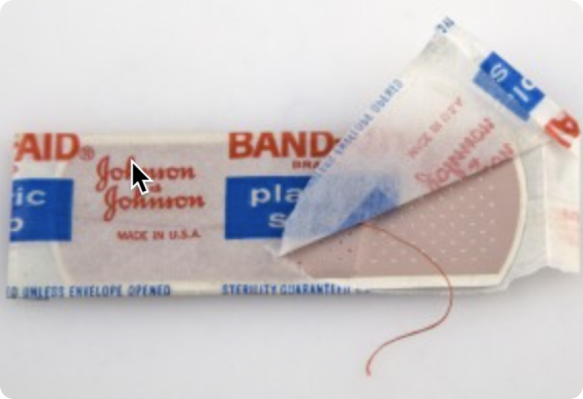 First pre-cut bandage product with red string from 1924
