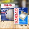 Old vs new look of BAND-AID® Brand TRU-STAY™ Large Sheer Bandages